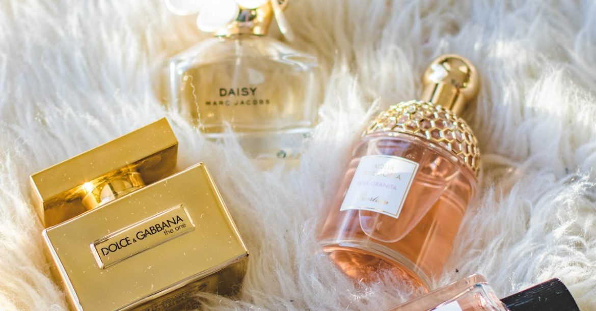 A collection of elegant perfume bottles arranged on a plush fur surface, showcasing luxury and sophistication.